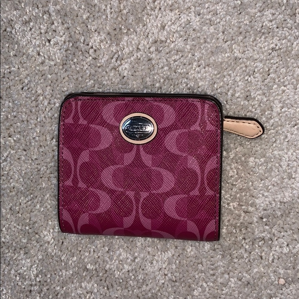 pink/purple colored coach wallet!